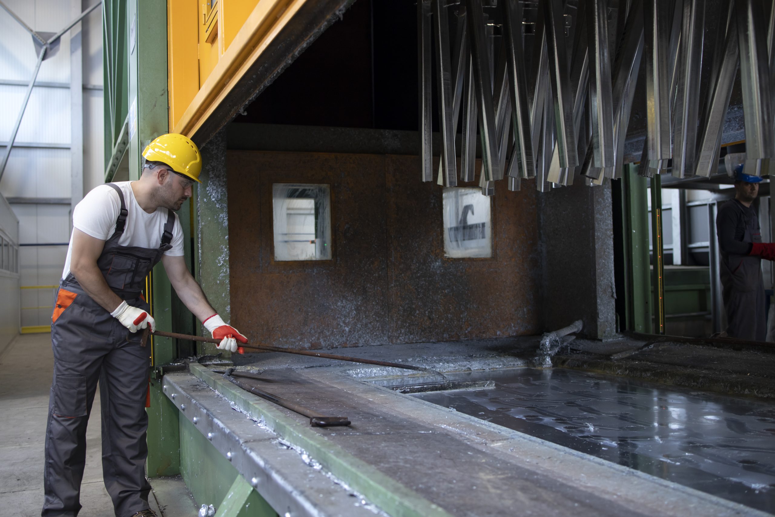 Working in metal processing factory.